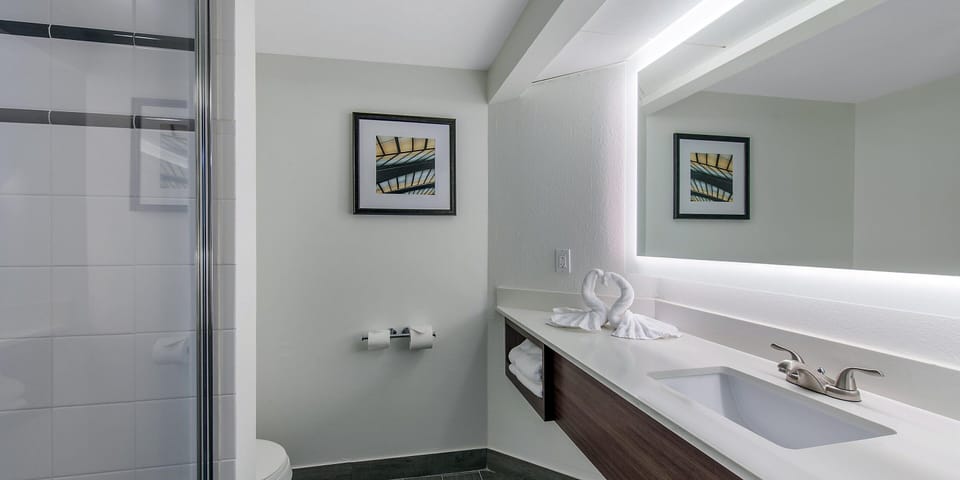 Recharge with a hot shower and bright, modern finishes.