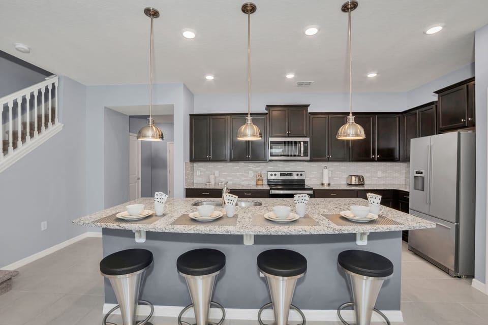 The Kitchen- With modern amenities at your fingertips, it's a chef's paradise, promising delightful meals and unforgettable gatherings in the heart of the home.