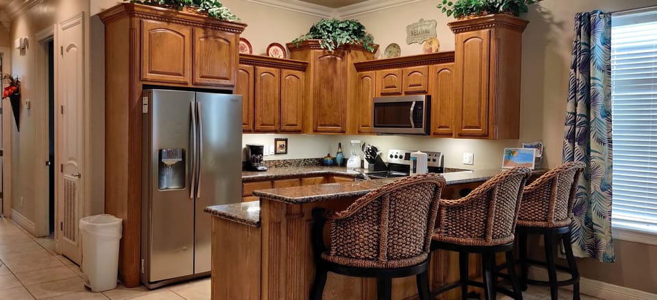 Kitchen with granite countertops. 