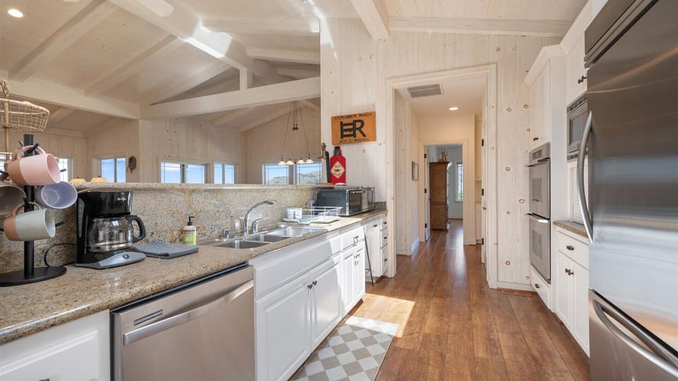 This bright, spacious kitchen is a dream space for cooking and gathering.