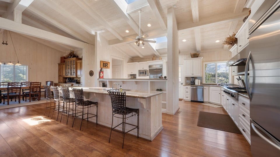 Picture yourself preparing meals in this beautiful open kitchen with spacious island, perfect for gathering with loved ones over morning coffee or evening drinks.