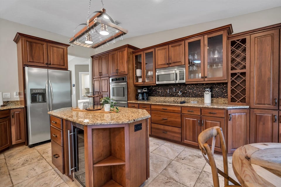 Hello-Check out this Kitchen! Everything you could ever want: Double Oven, Wine Fridge, Water/ Ice Fridge, Dishwasher and a Pot Filler!