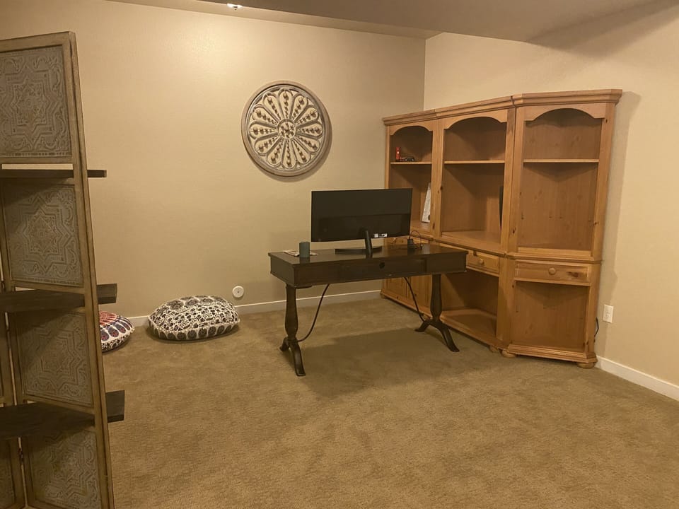 Office space with desk and monitor 