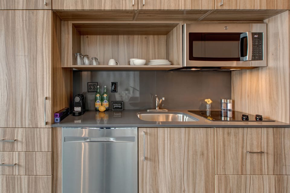 Kitchenette with 2-Burner Electric Stovetop, Refrigerator, Microwave and Dishwasher. No Oven