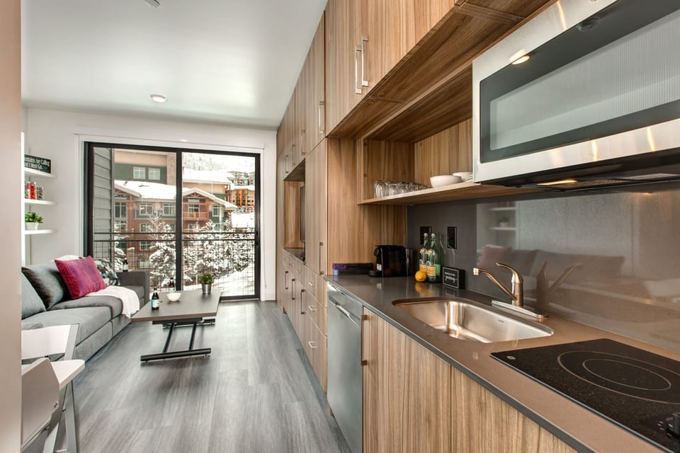 Well Equipped Kitchen with a Coffee Maker and Cooking Utensils