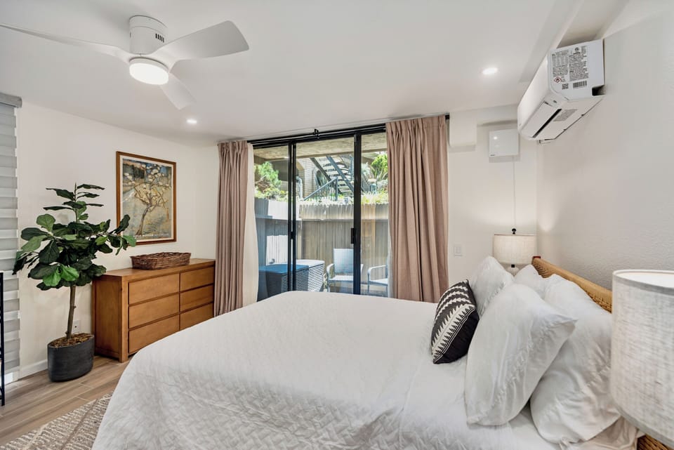 Comfortable bedroom with patio access and mini-split AC