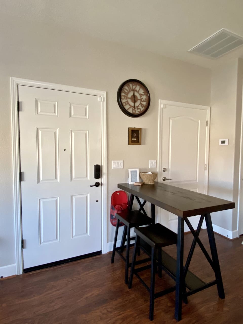 Guest suite entry left door. Dining area. Slippers in red pouch provided. 