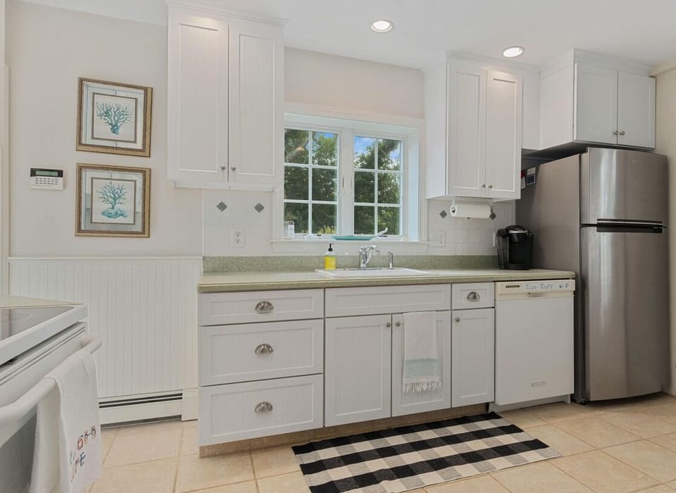 1st Floor - Kitchen with stove, dishwasher, and fridge