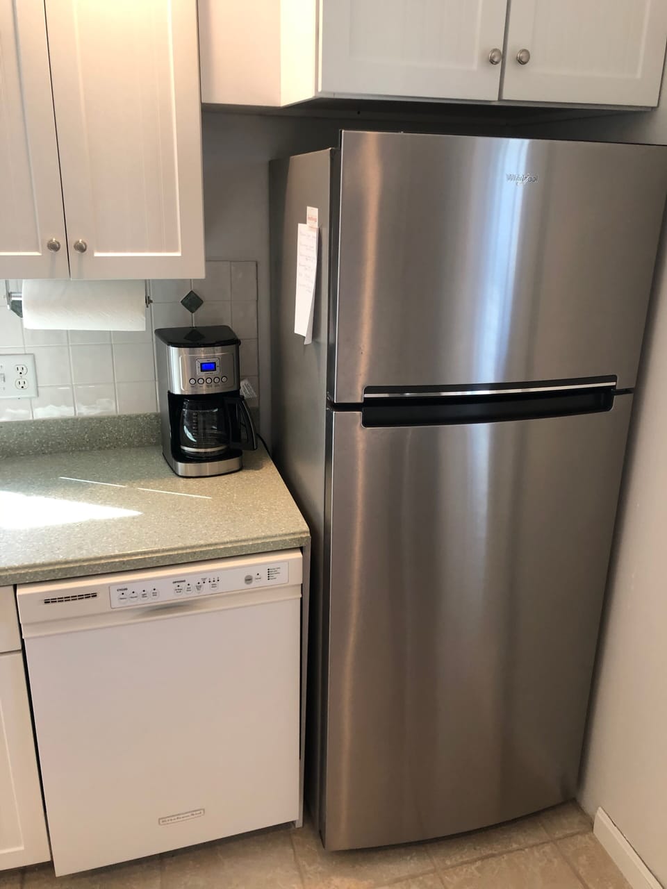 1st floor - Kitchen fridge, dishwasher, and coffee maker