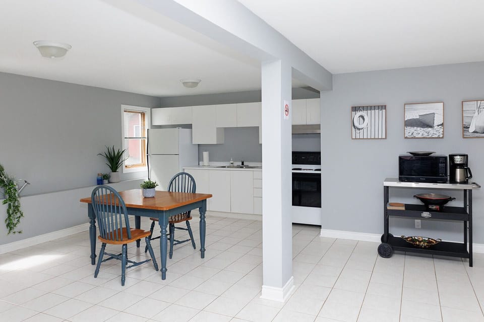 kitchen, with electric stove, microwave, toaster, coffee pot, fridge