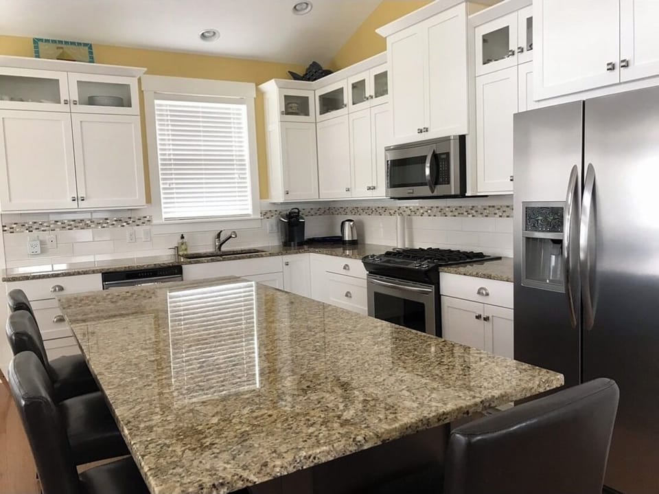 Large island for food preparation and gathering. 