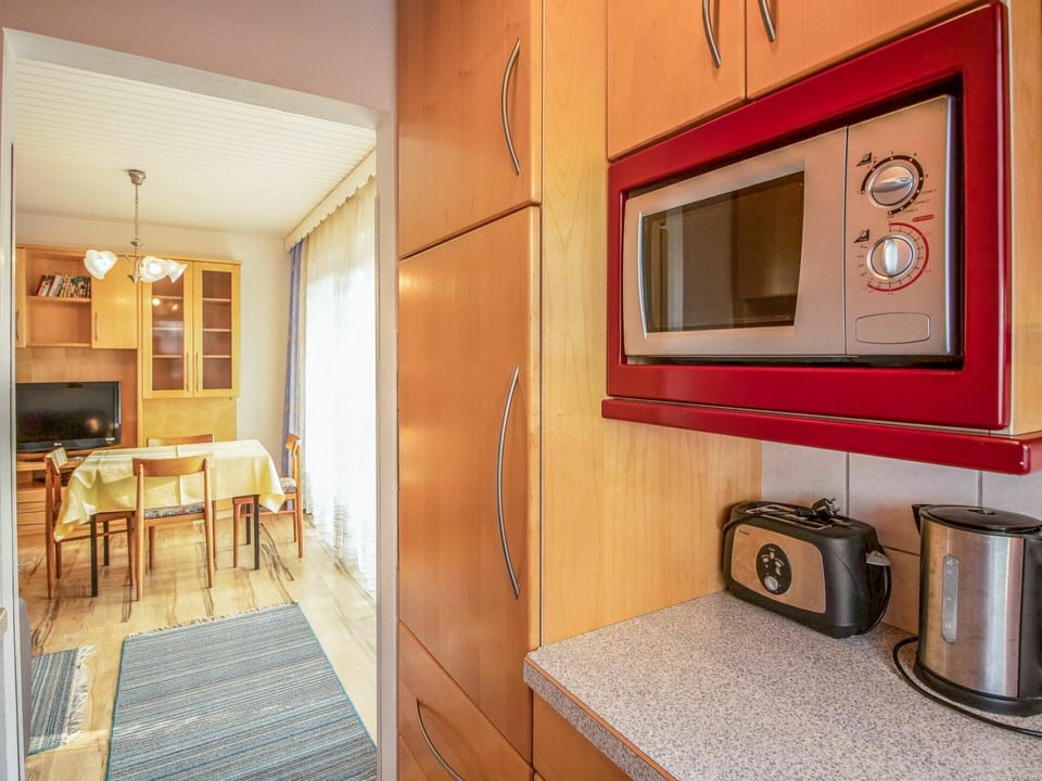 Furniture, Building, Wood, Interior Design, House, Cabinetry, Living Room, Table, Floor, Door