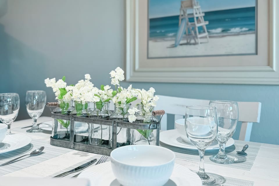 Gather round. Thoughtfully prepared for comfort and conversation, this dining area promises delightful shared experiences.