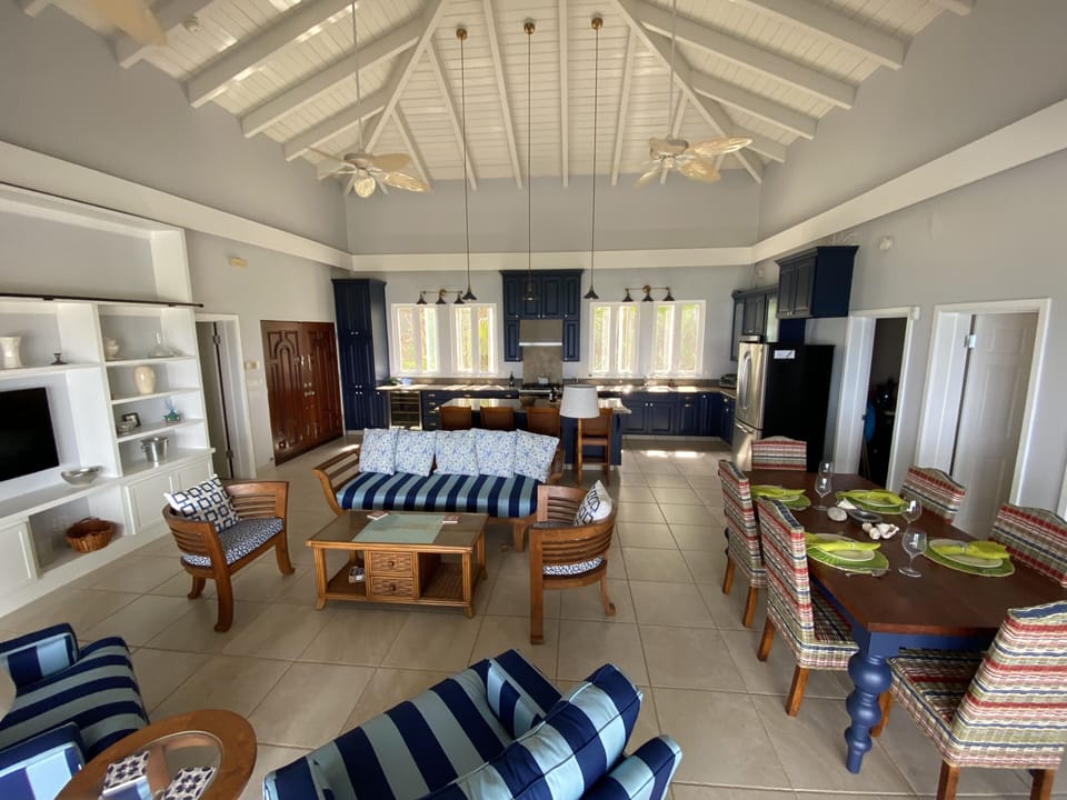 Newly redecorated Great Room is a showstopper with soaring ceiling and light.