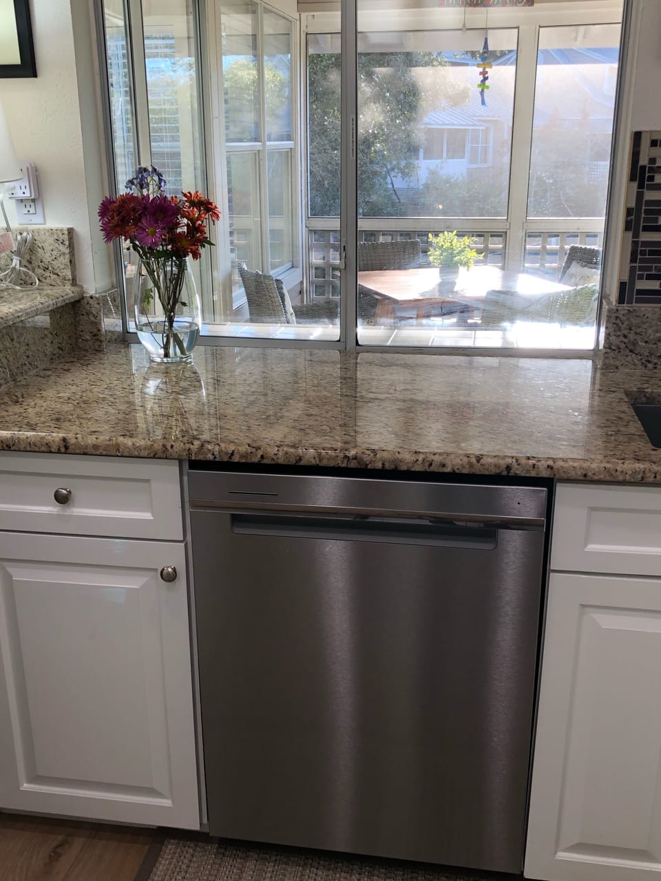 Kitchen with pass-thru window to screened-in porch