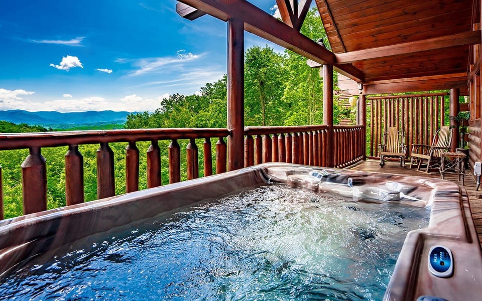 Relax in the hot tub with breathtaking views of the Smoky Mountains.