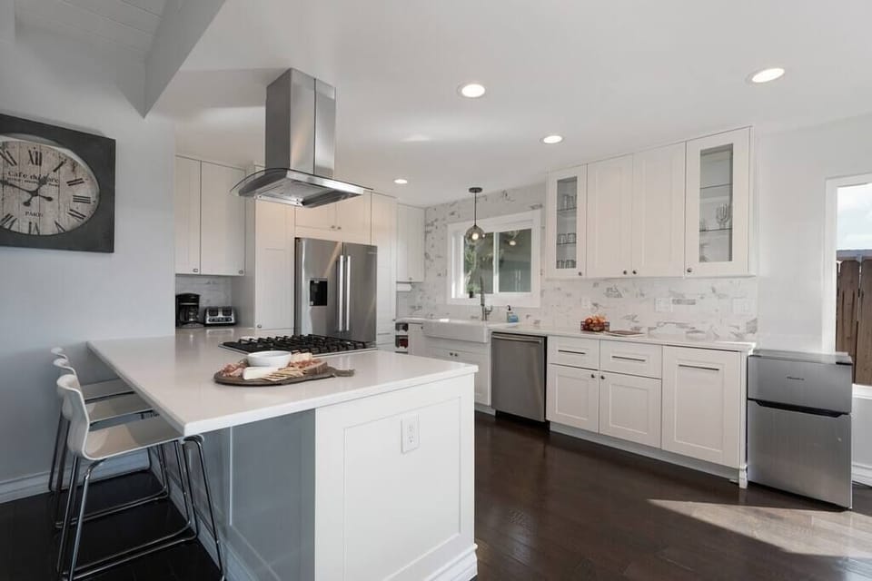 The recently remodeled gourmet kitchen is a dream with fresh and spacious countertops and stainless steel appliances.