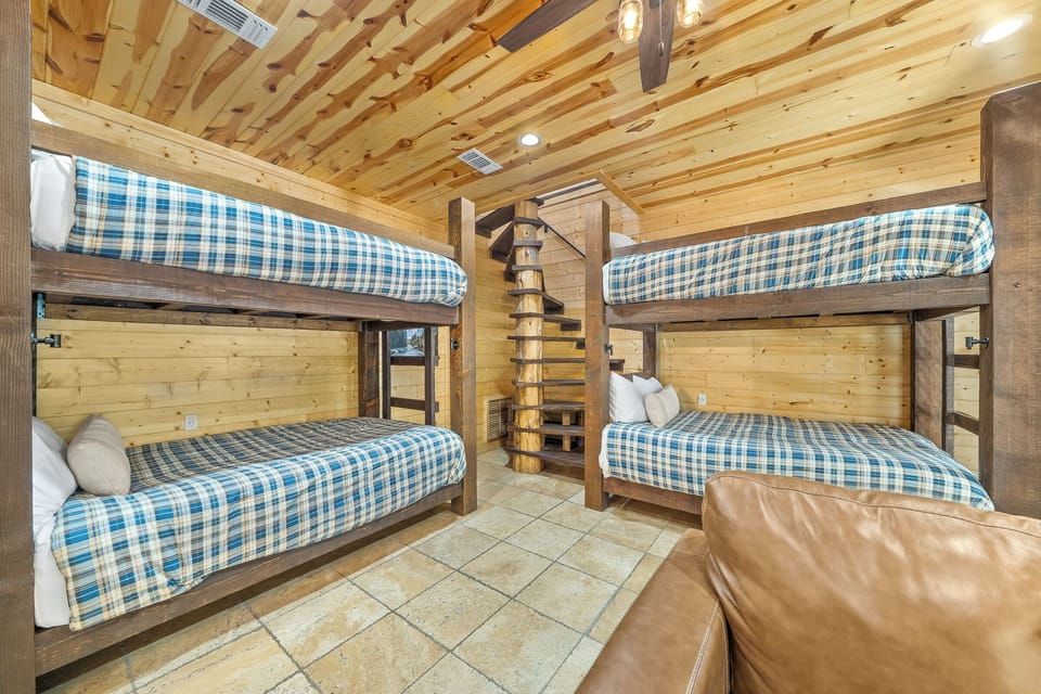 Downstairs bunk room with 4 full beds with full bathroom as well.