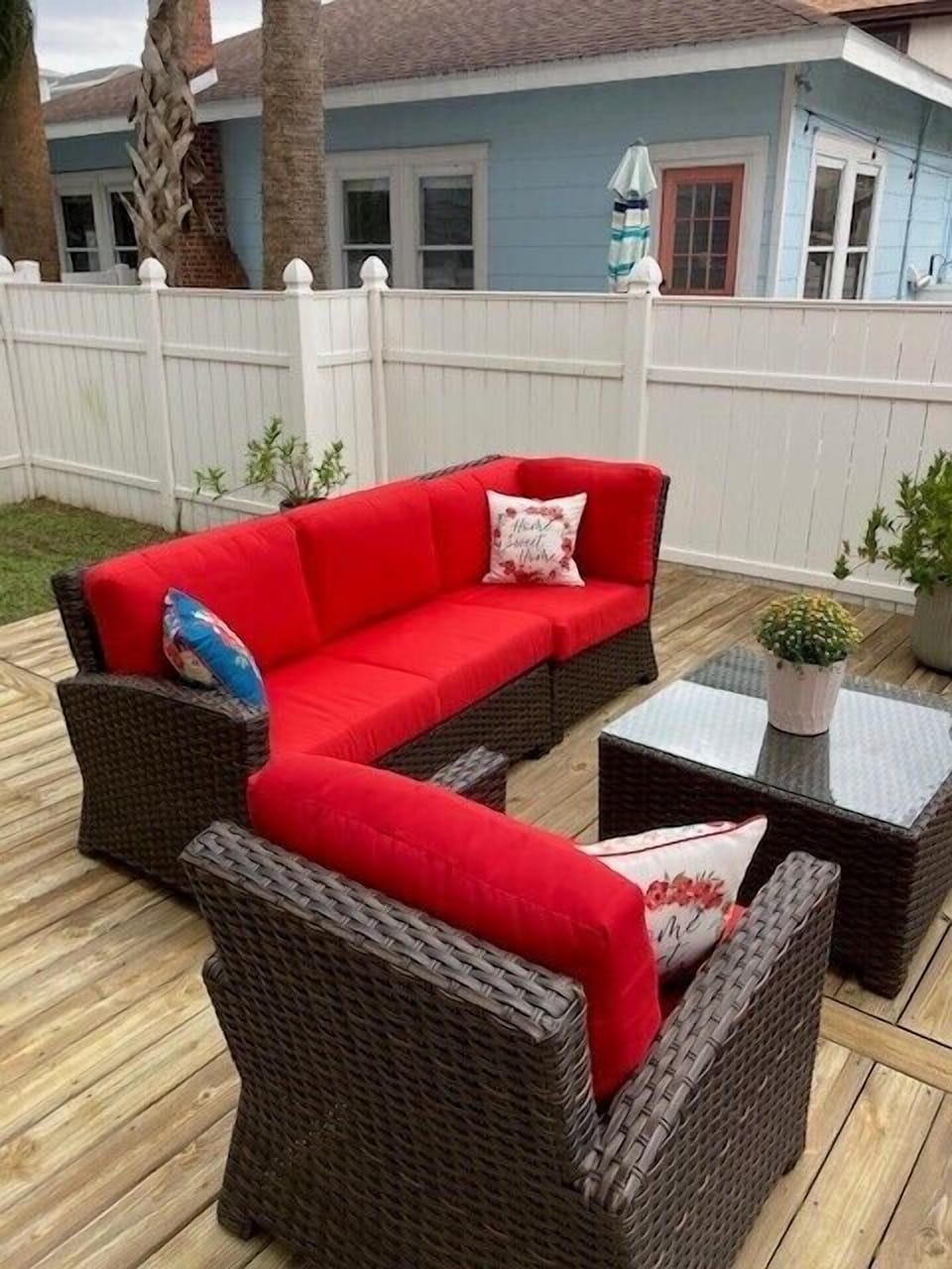 - Catch some rays or sip cocktails on this fenced in patio with plush sectional seating and decorative pillows
- Stylish potted greenery adds a fresh touch to your relaxation space
- Ideal outdoor nook for quiet moments or friendly gatherings