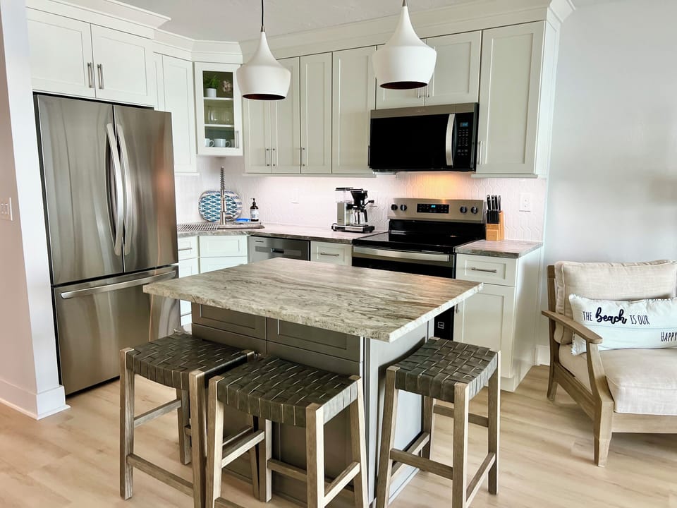 Soft close cabinets, all brand new appliances, and plenty of cookware and dishes