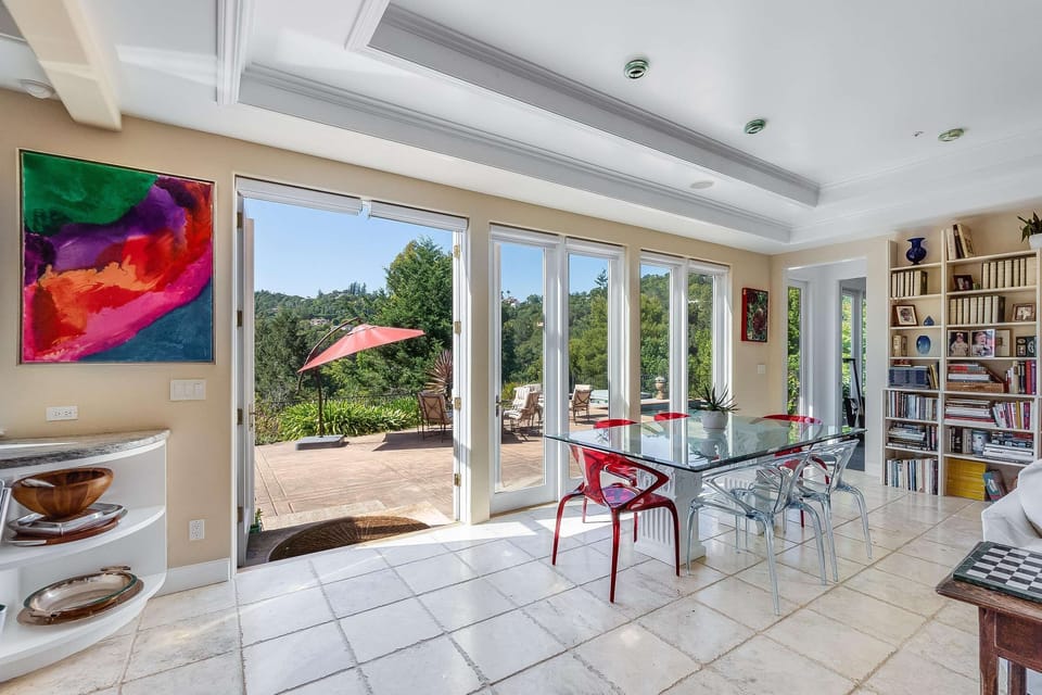 Family room opens to deck, pool and spa.