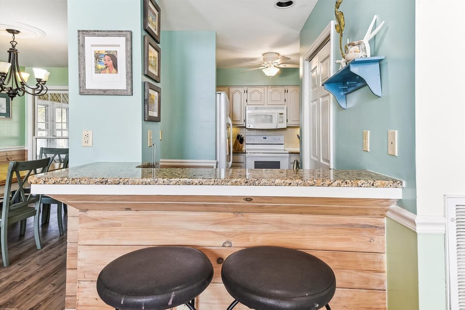 The kitchen counter provides additional  space for serving snacks or meals.