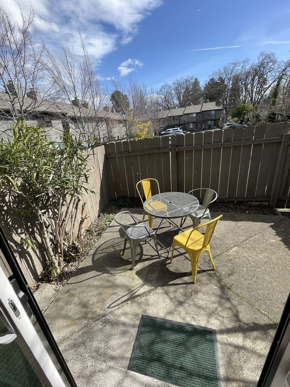 Back patio off kitchen/dining leads to dedicated parking. 