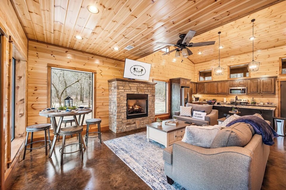Love the open concept of the den, dining room pub table, and kitchen!