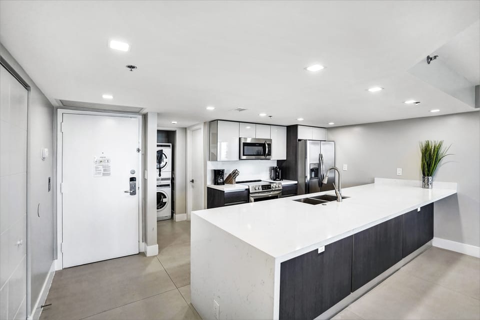 Fully equipped kitchen with washer/dryer, front door