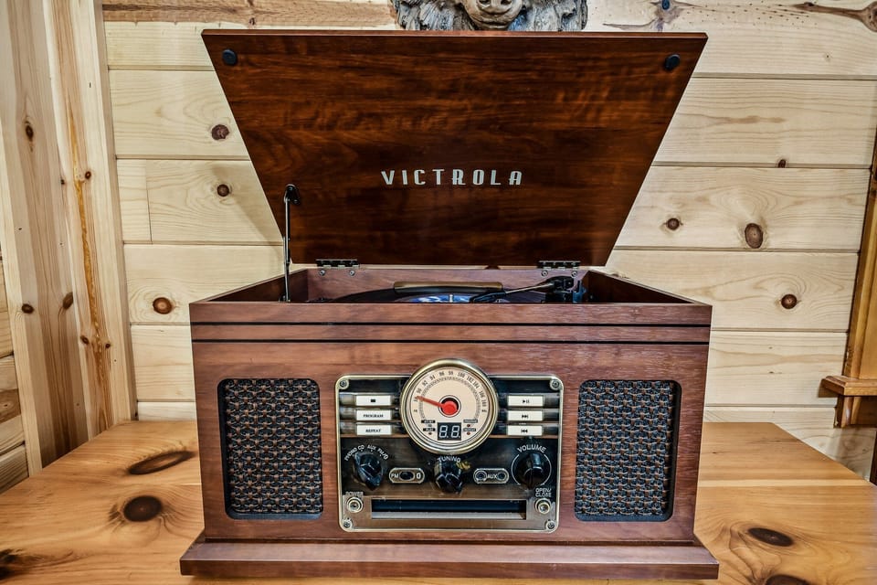 Open Victrola turntable record player adding retro Smoky Mountain cabin charm at Amazing Dreams cabin in Sevierville, Tennessee — just minutes from Pigeon Forge.