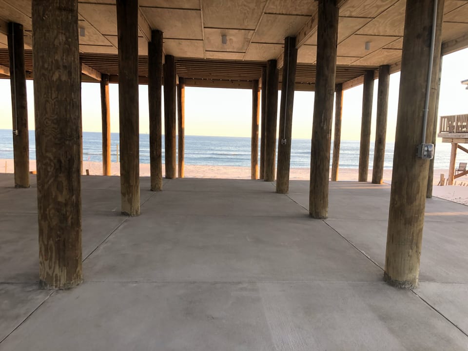 Concrete parking under the house for 4 vehicles 