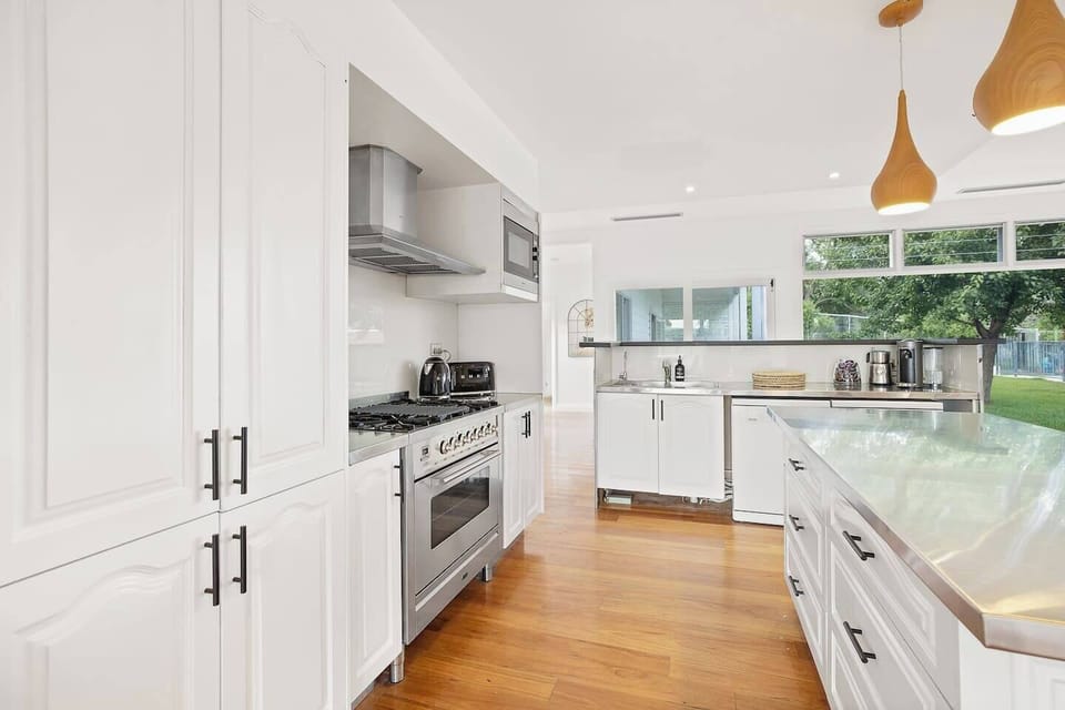 The kitchen is fully equipped with stainless steel appliances and even with two dishwashers for easy cleanup.