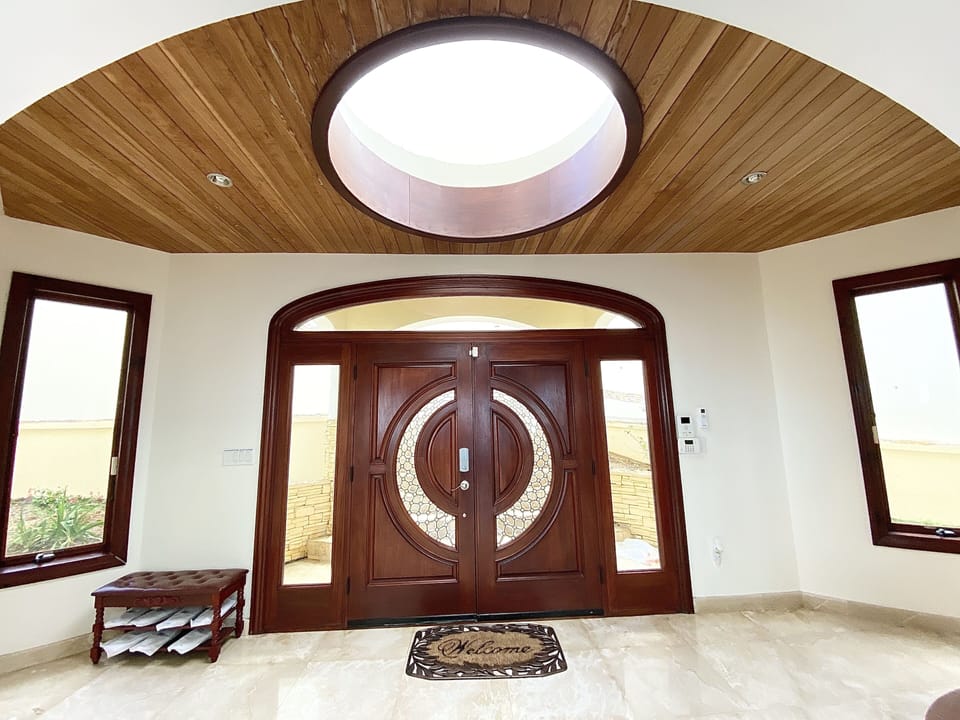 A captivating welcome -Foyer with overhead dome encircling the front entrance