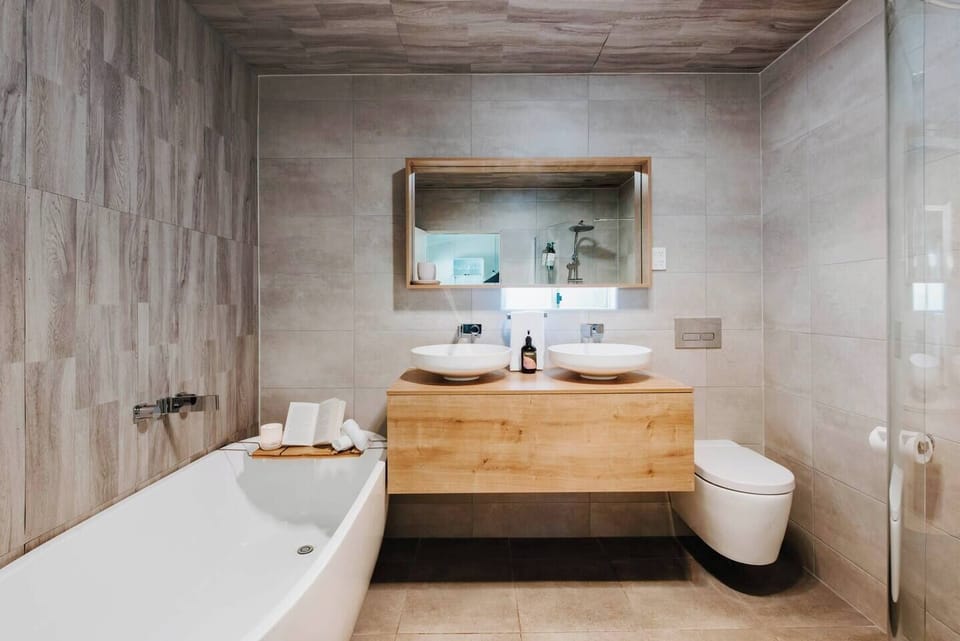 The luxe bathroom is complete with everything you need during your stay.
