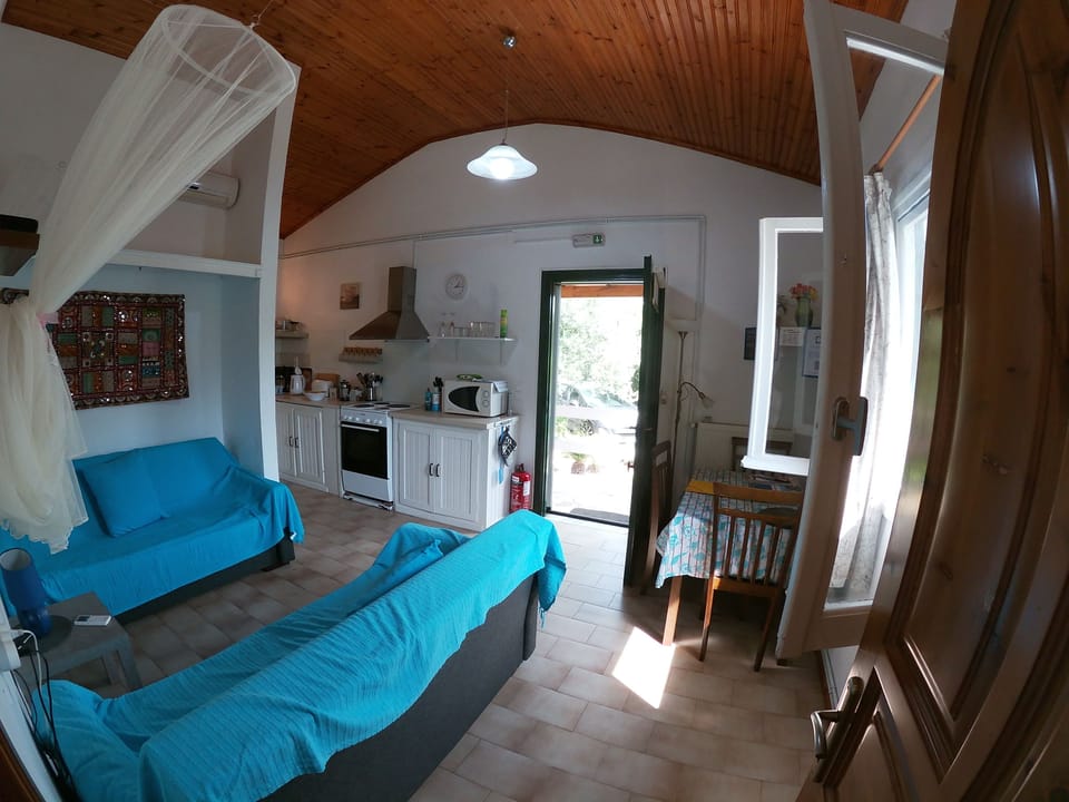 Lounge / dining area with kitchen and utility room behind 
