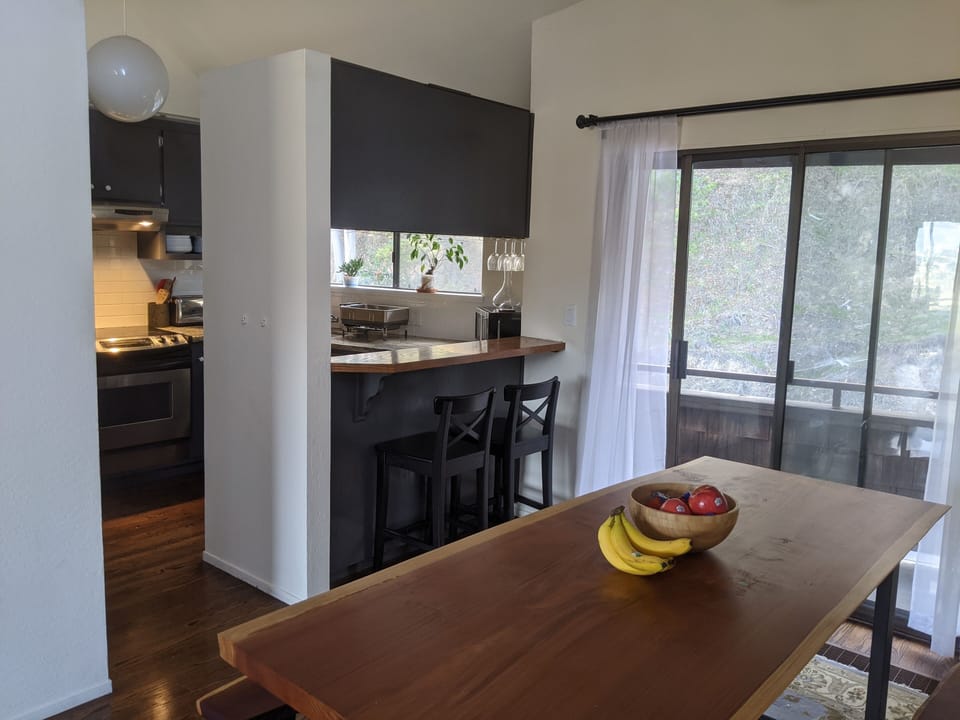 The dining table and kitchen area

