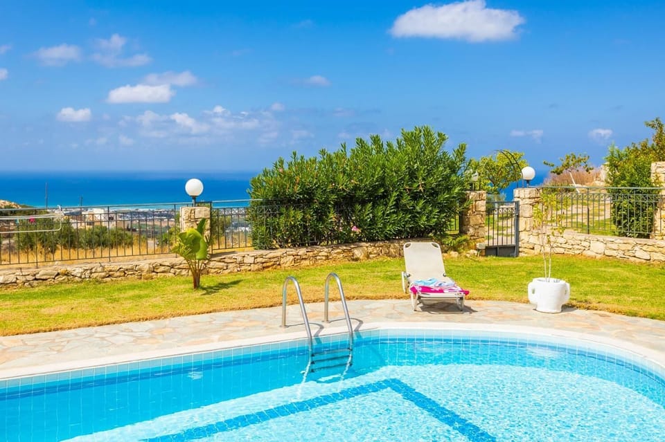 Private pool, terrace, and garden with sea views