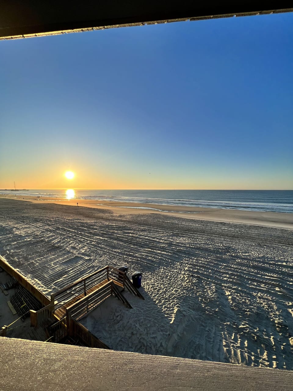 View of sun rising from balcony