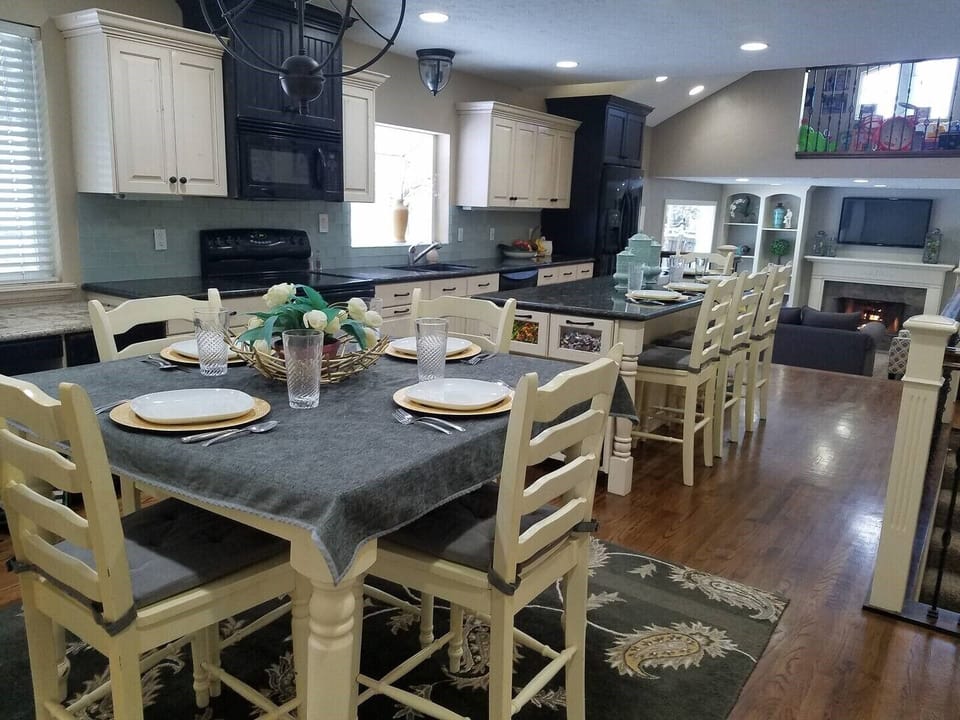 Plenty of seating at the table and bar with table insert for additional seating
