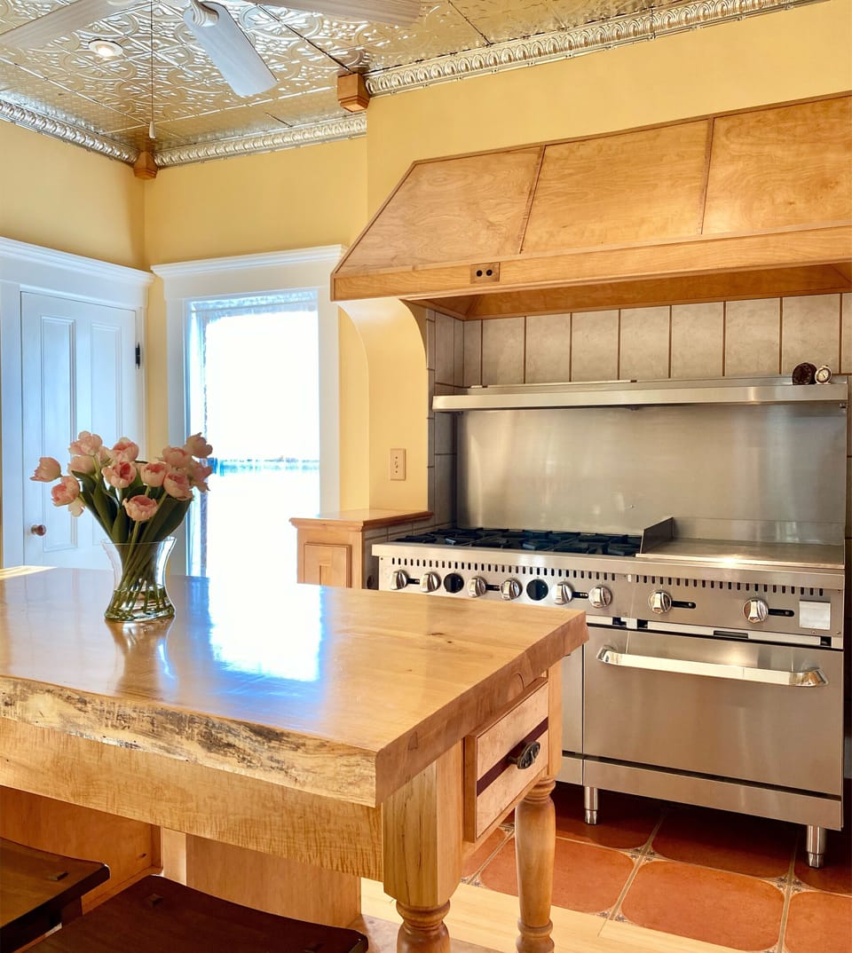 Large kitchen with 6 burner range and double oven