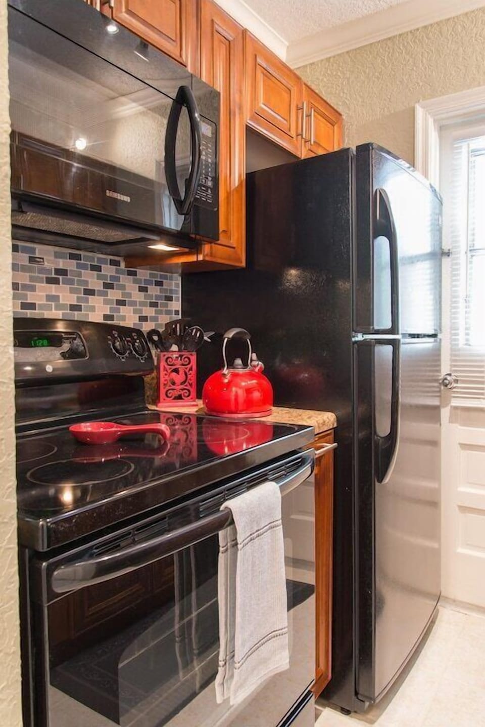 Kitchen includes full size appliances (refrigerator, microwave, stove, dishwasher, coffee maker, toaster oven, etc). 