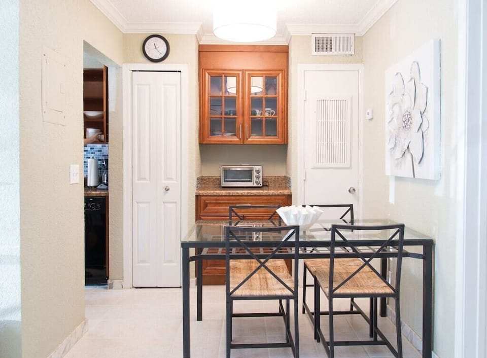 Dining table easily seats 4 guests right outside the kitchen