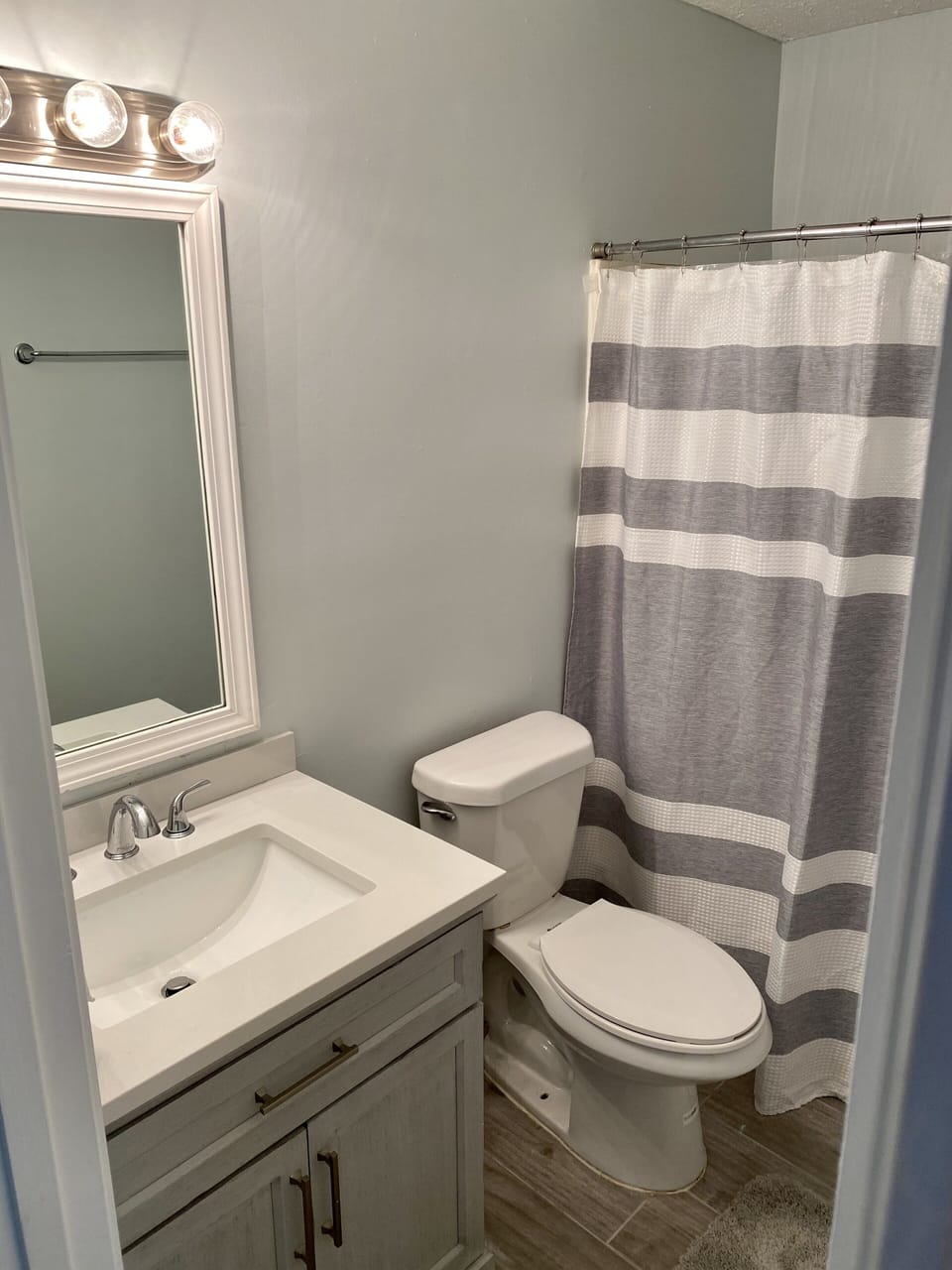 Shared full bathroom with bunk and queen room