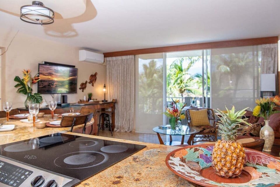 A bright kitchen and dining area opens to the lanai, making indoor-outdoor dining both easy and enjoyable.