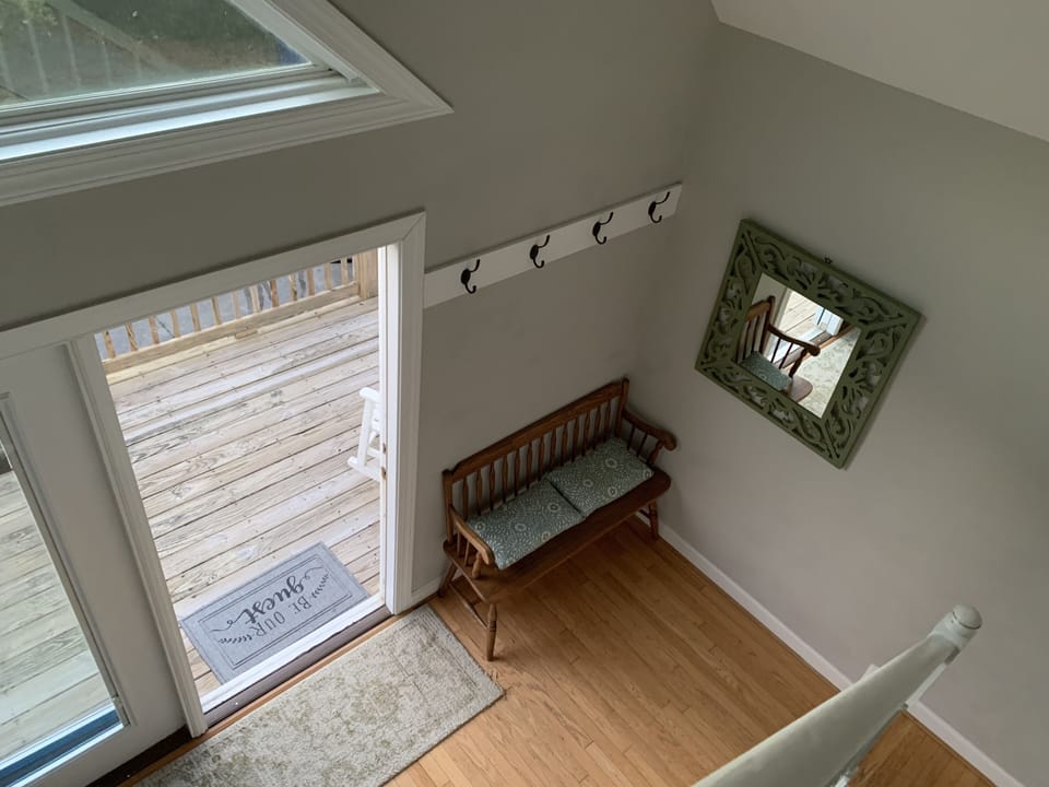 Two-story foyer at upper entrance