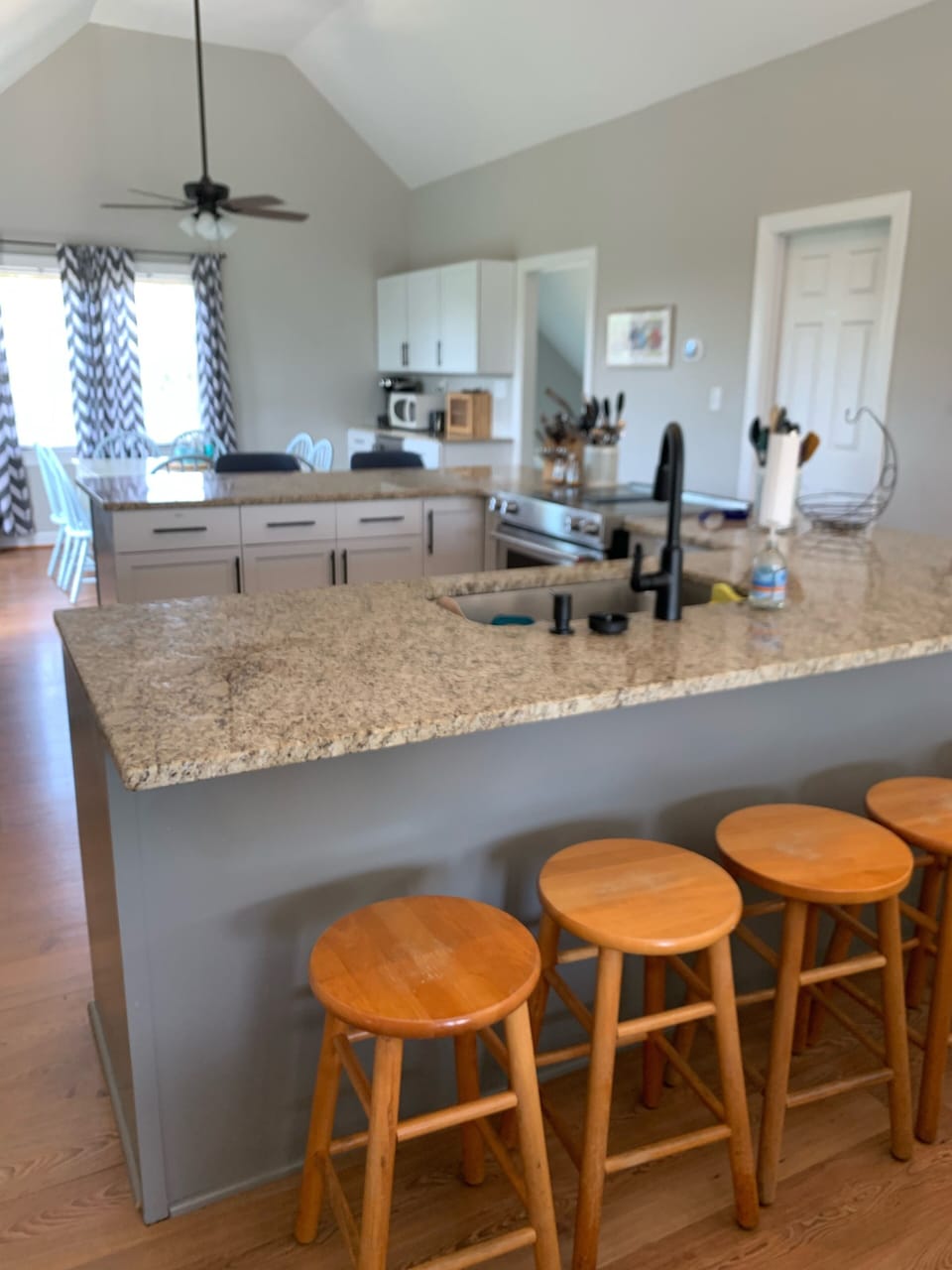 Kitchen with granite, looking towards the dining room and coffee bar