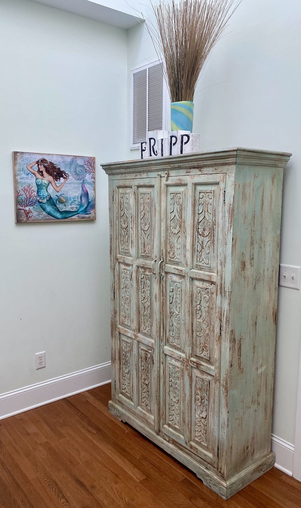 Cabinet filled with plenty of books, puzzles, and board games for rainy days.
