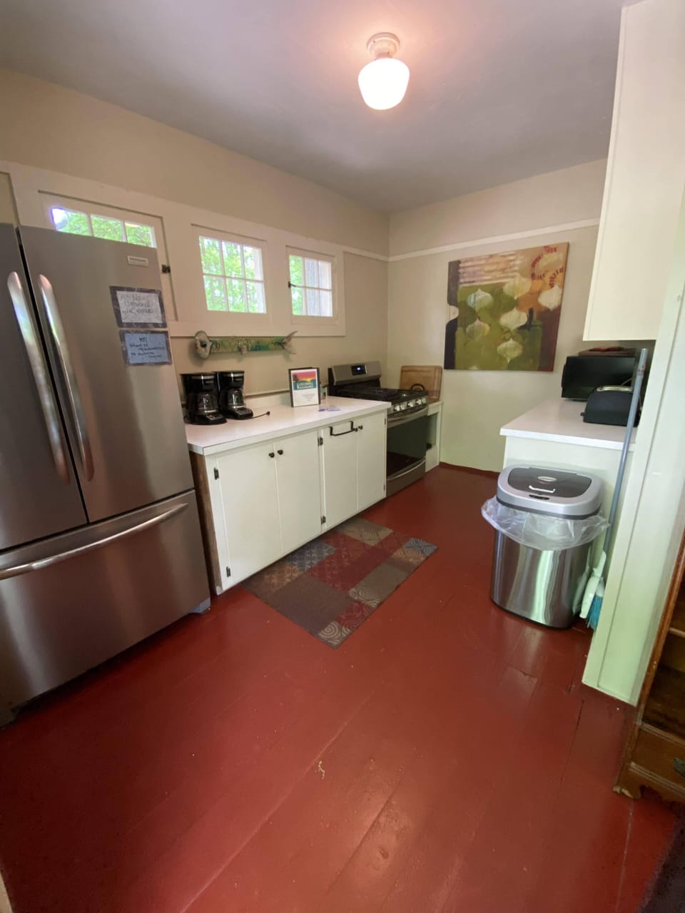 Roadside entrance into first kitchen space, fully stocked, an oven and 2 fridges