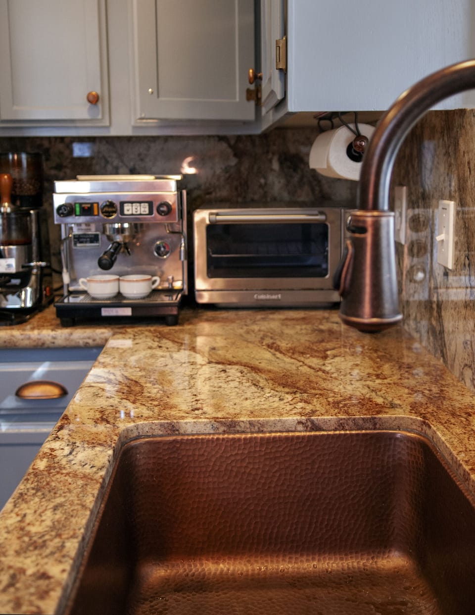 Kitchen includes a toaster oven, microwave, commercial espresso, drip coffee