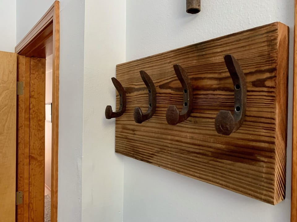 Rustic hanging hooks in the master bedroom